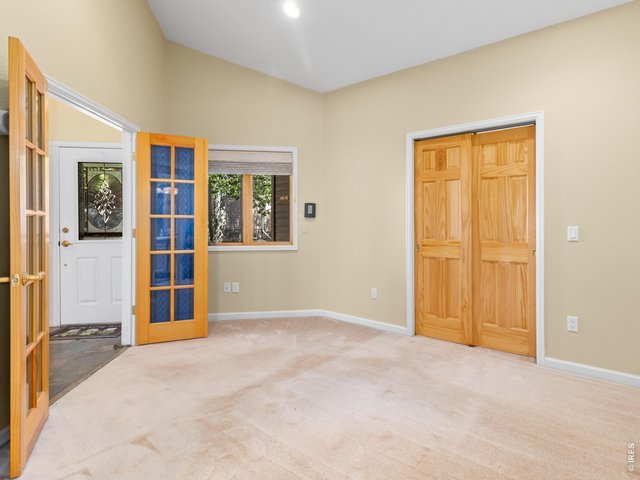 Property Photo 27 Bedroom 3 or main level office with French doors