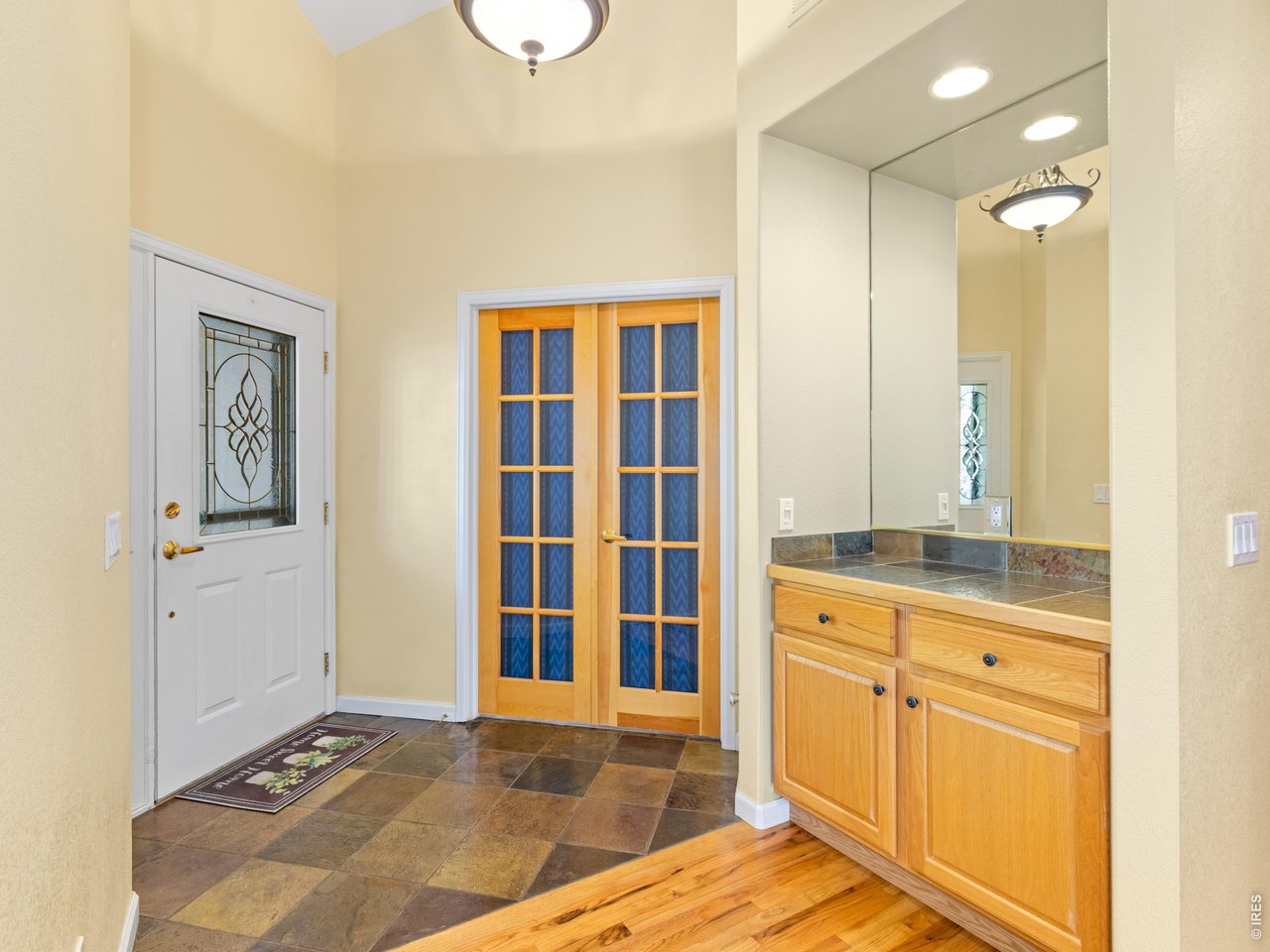 Entryway and French doors to office/bedroom 3