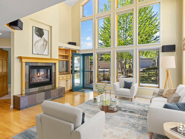 Property Photo 3 Wall of windows and warm fireplace