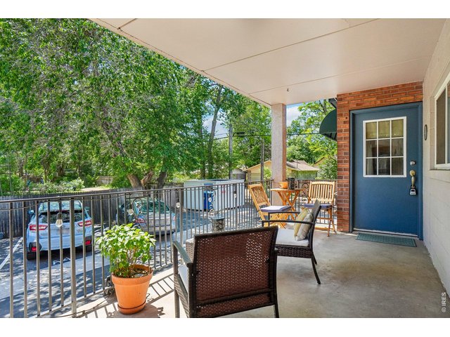 Property Photo 3 Large Balcony with Western Views of Old Town and the Mountains.