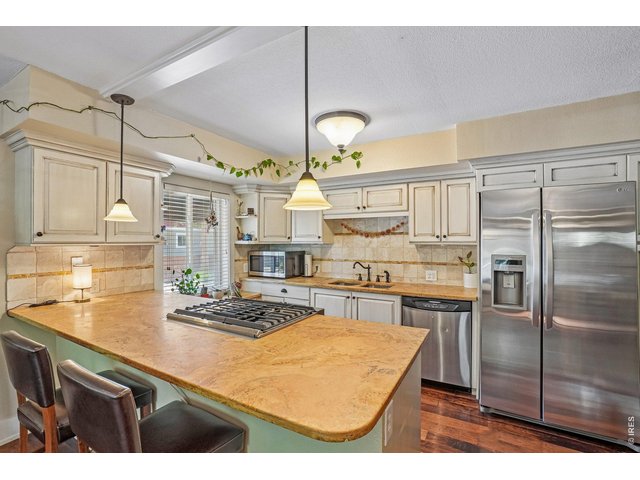 Property Photo 8 Travertine Countertops & SS Appliances