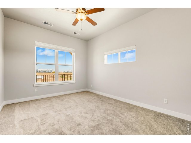 Property Photo 8 Primary bedroom w/ ceiling fan included! 