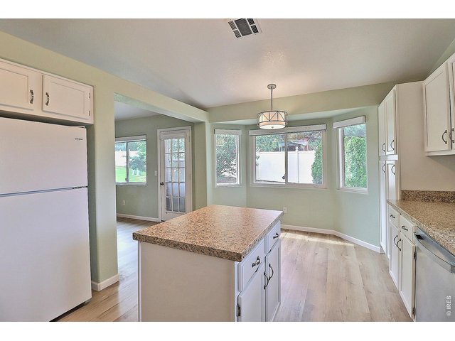 Property Photo 20 Kitchen Dining with Access to Back Patio