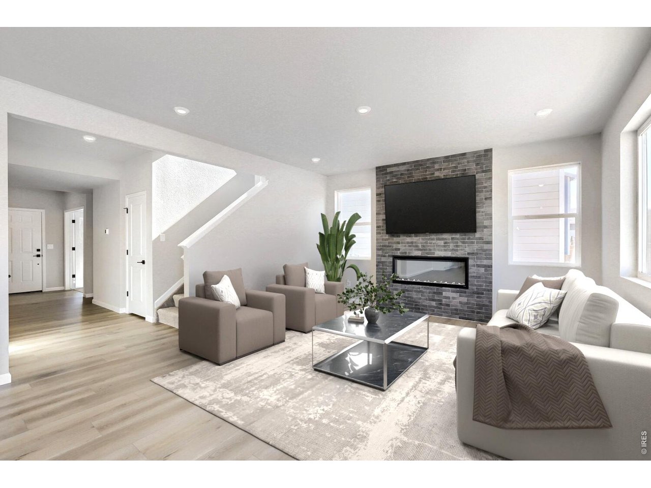 Great room centered by gas fireplace