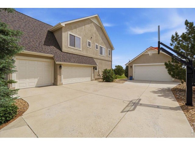 Property Photo 3 Large attached 3 car garage AND additional detached shop with mini-split and room for all your toys