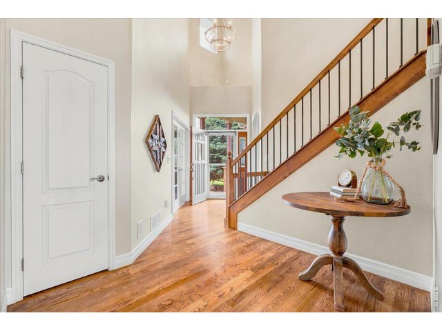 Property Photo 22 Grand entry with refinished hardwood floors