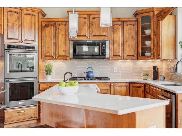 Property Photo 14 Quartz countertops and designer backsplash