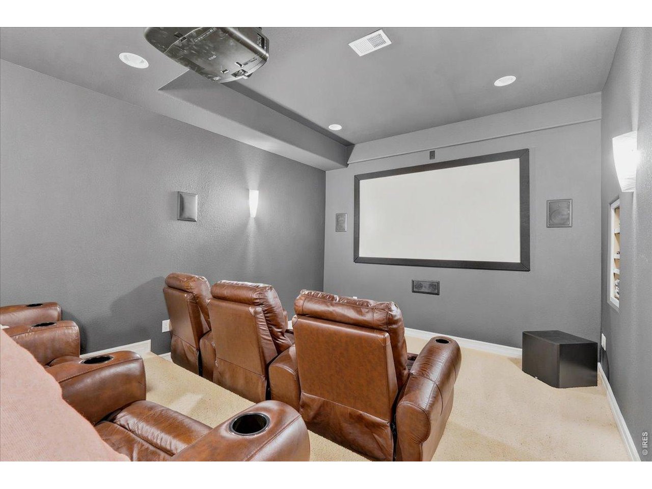 Deluxe theater room comes with all theater equipment and reclining movie chairs
