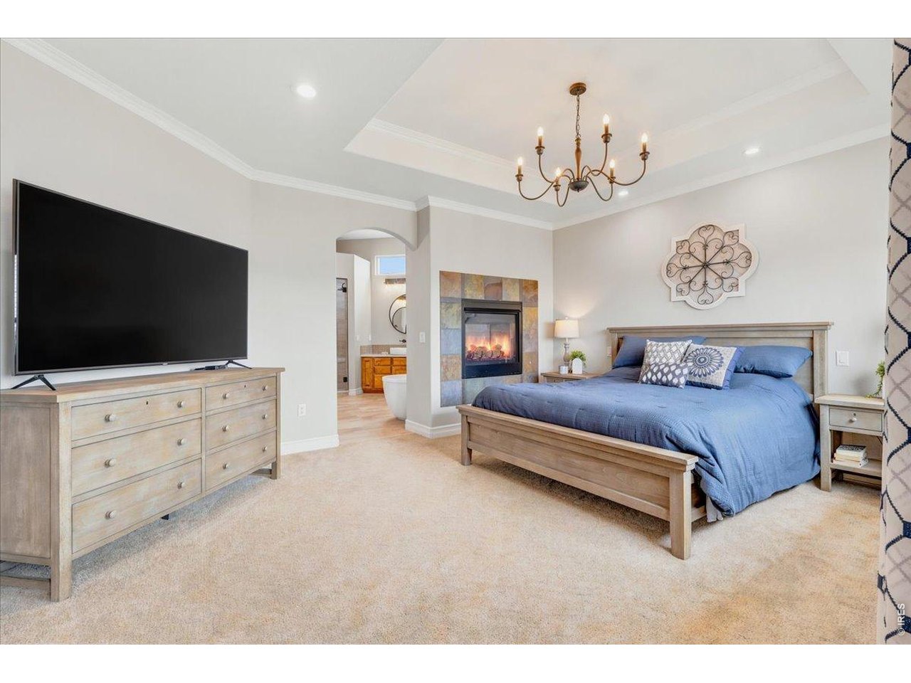 Massive primary retreat with tray ceilings and gas fireplace