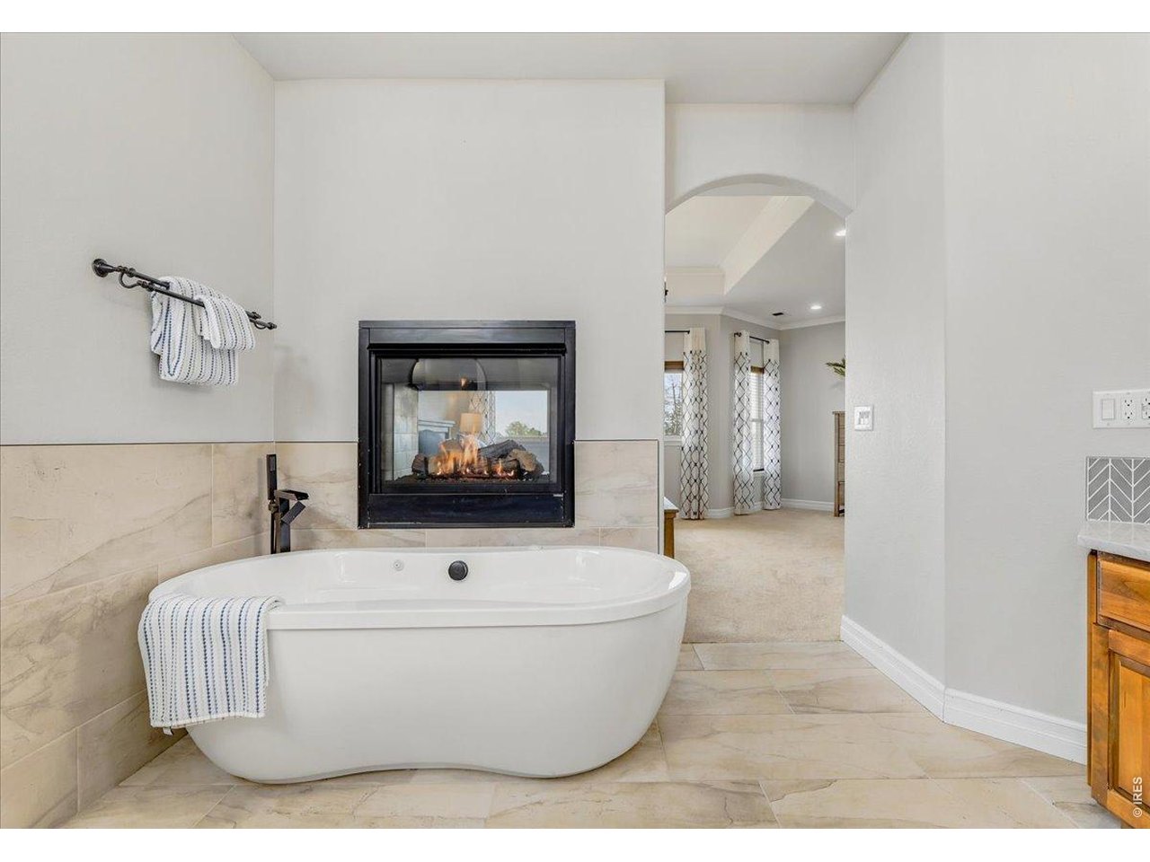 Air jetted tub + cozy fireplace = the bathroom of your dreams