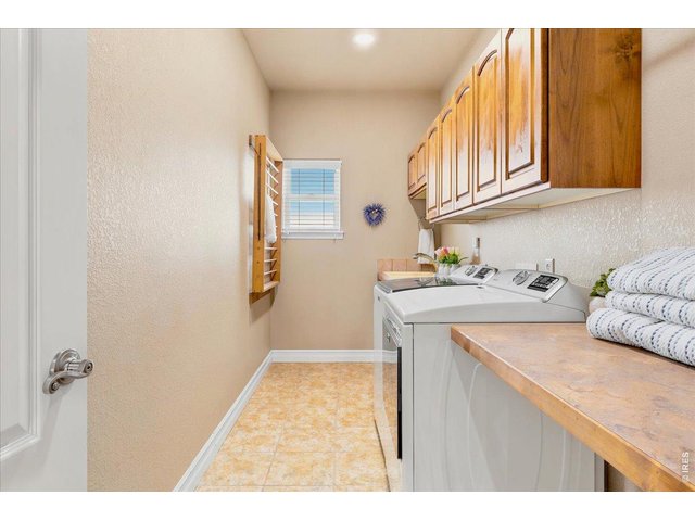Property Photo 36 Large 2nd floor laundry with laundry sink and folding counter