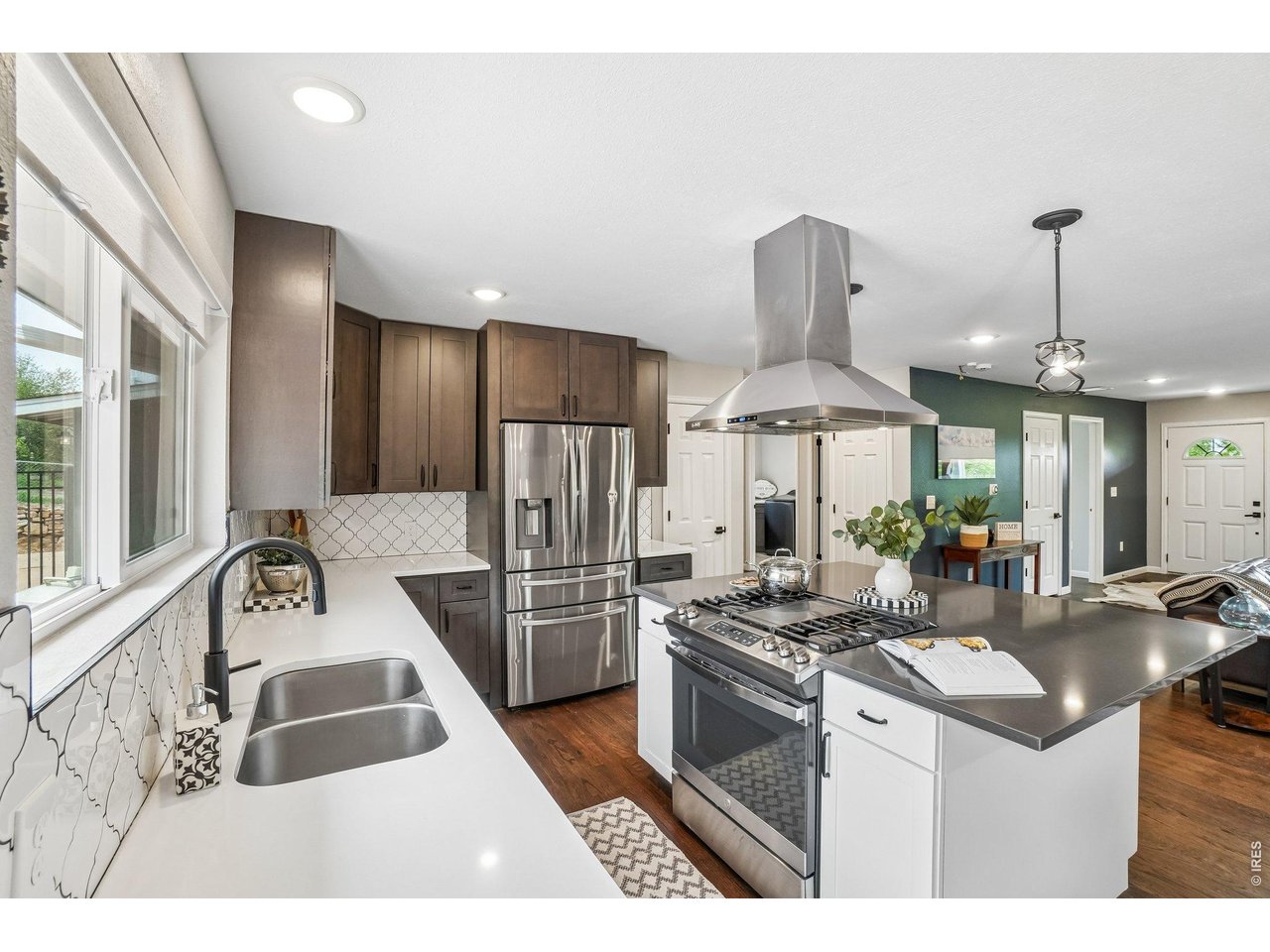 Property Photo 12 This gourmet kitchen offers quartz countertops, high-end appliances, and a large island ideal for entertaining.