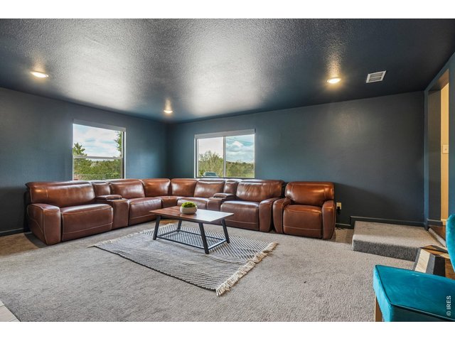 Property Photo 29 Family room comes with the leather sectional