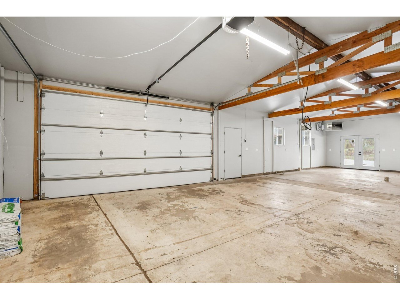 Property Photo 35 Oversized garage/workshop has underfloor PVC piping for dust collection. The 240 is ideal for a wood shop and or a vehicle lift. 