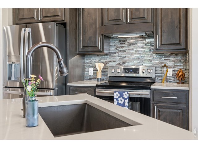 Property Photo 12 Stainless steal appliances and vented range hood