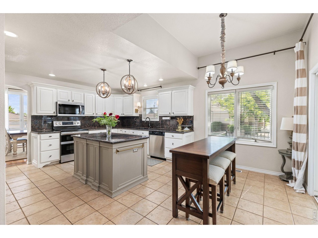Remodeled Kitchen Flows Right Into Formal Dining Room to the Left