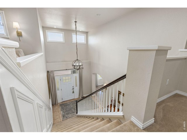 Property Photo 26 Wainscoting on Stairway to Upper Level
