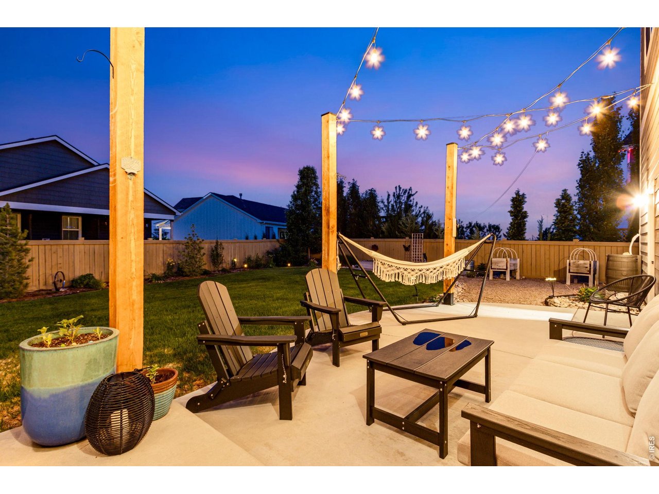 Oversized backyard concrete patio featuring a privacy fence. East facing so you can enjoy the shade and incredible summer nights