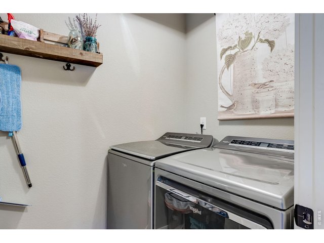 Property Photo 22 Upstairs laundry room with folding station, cabinets with both clothes washer and clothes dryer included 