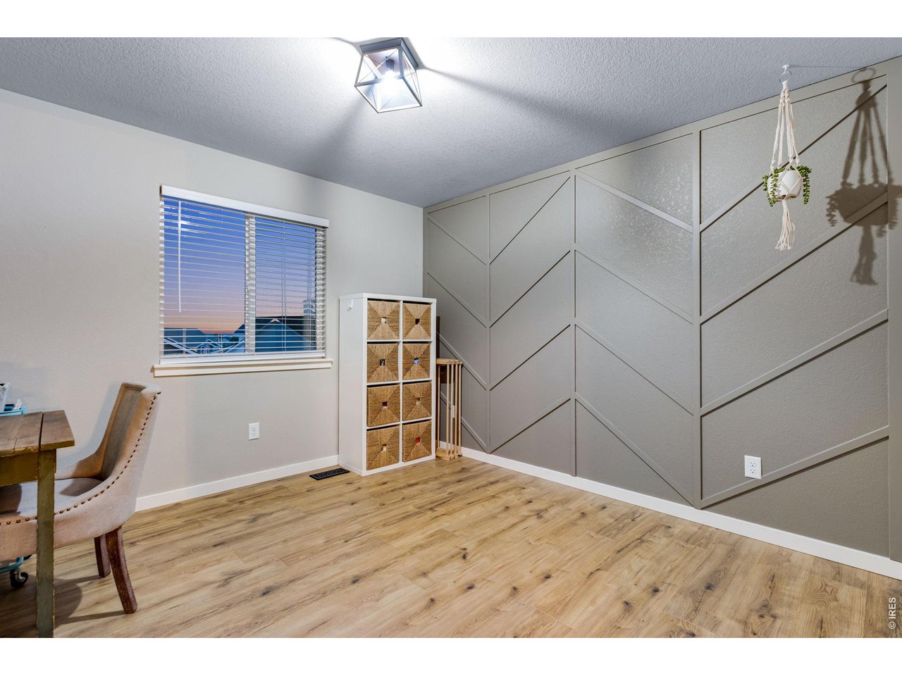 Bedroom 2 with decorative accent wall 