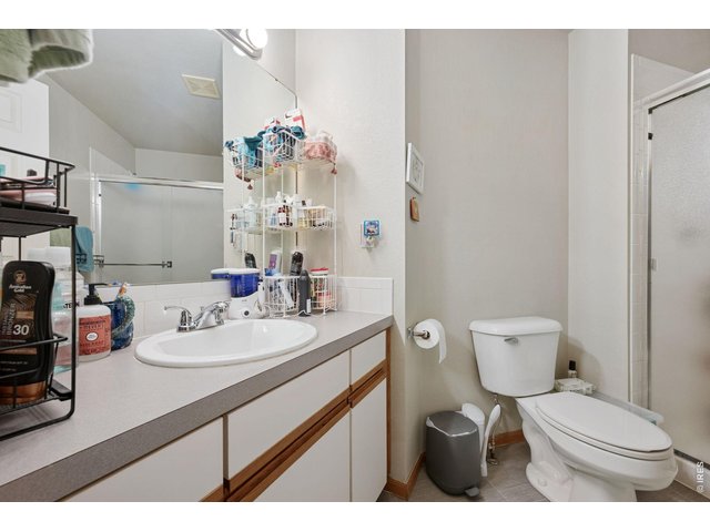 Property Photo 9 Ensuite primary bath with walk-in shower and newer flooring