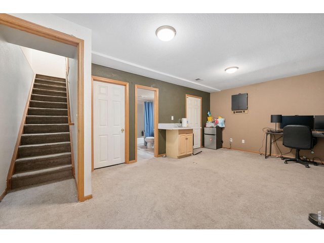 Property Photo 13 Large, open rec-room in finished basement with wet bar.