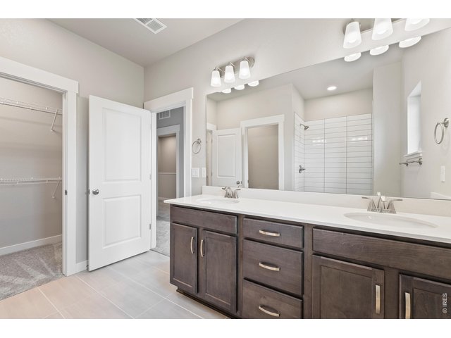 Property Photo 18 Primary bathroom with dual vanities
