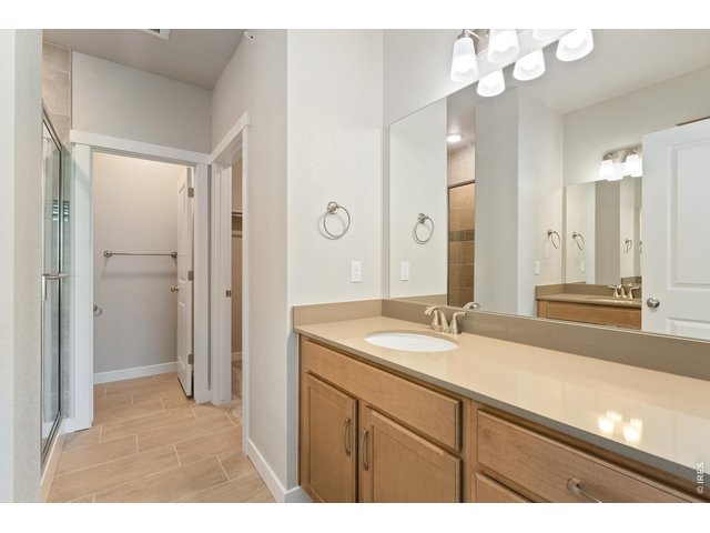 Property Photo 13 Primary bathroom with dual vanities on separate sides. 