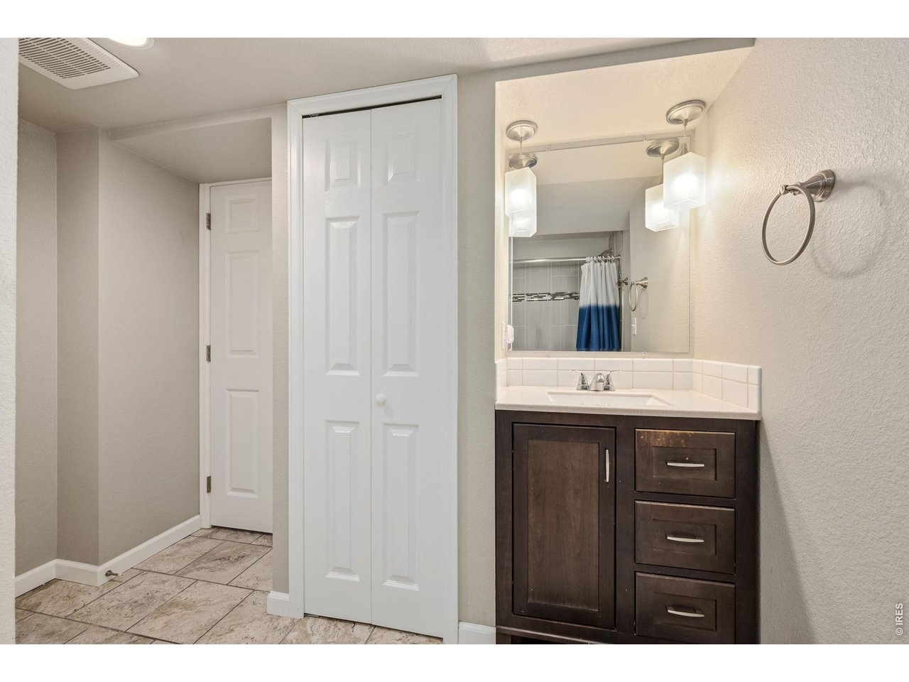 Basement bathroom with linen closet