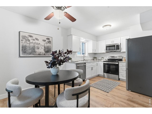 Property Photo 12 Dining flowing into kitchen 