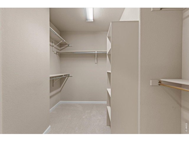 Property Photo 26 Walk in closet off primary bedroom