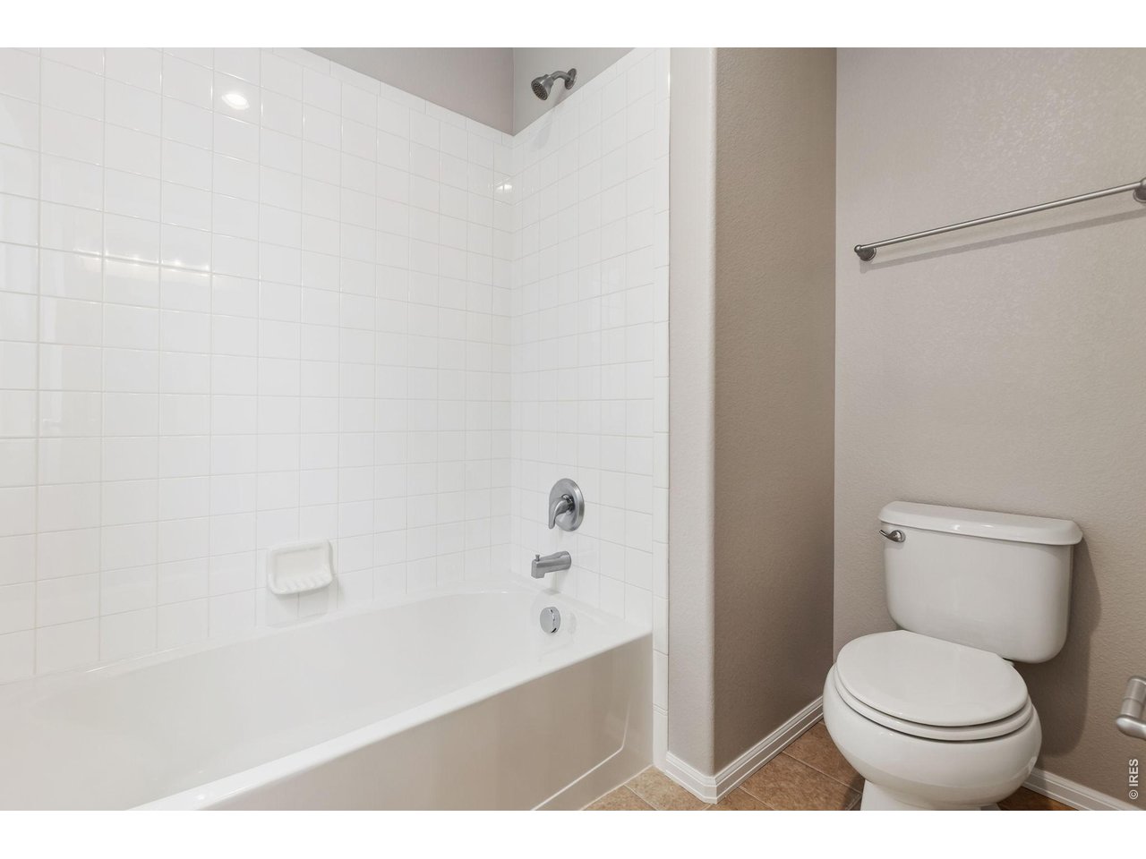 Toilet and shower separated from sinks