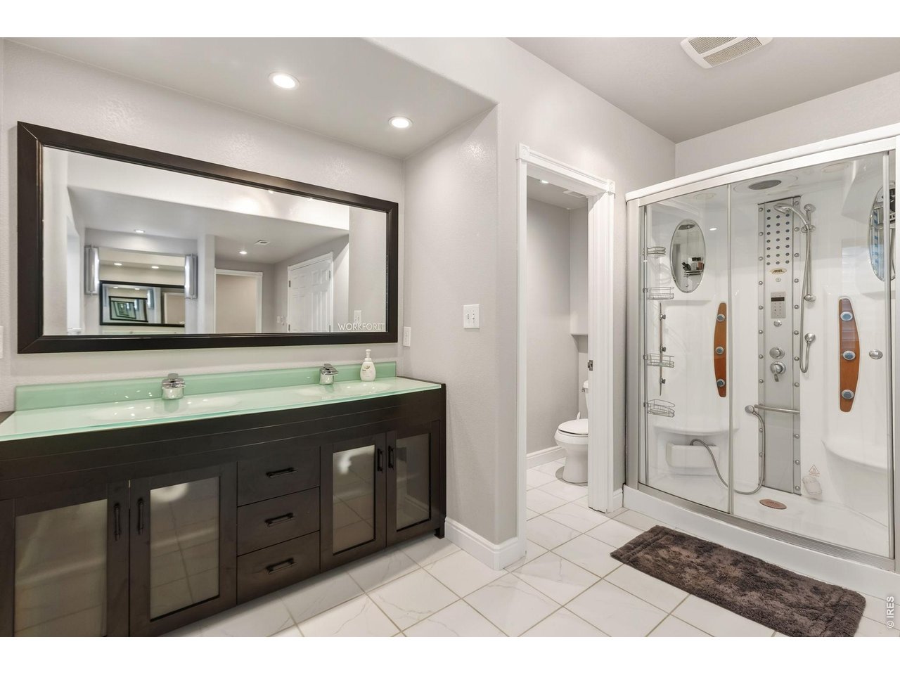 Huge bathroom with multi-head shower