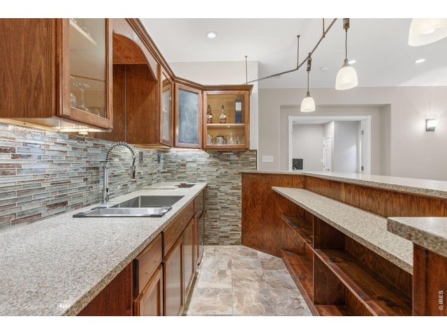 Property Photo 33 Basement wet bar with under cabinet lights!