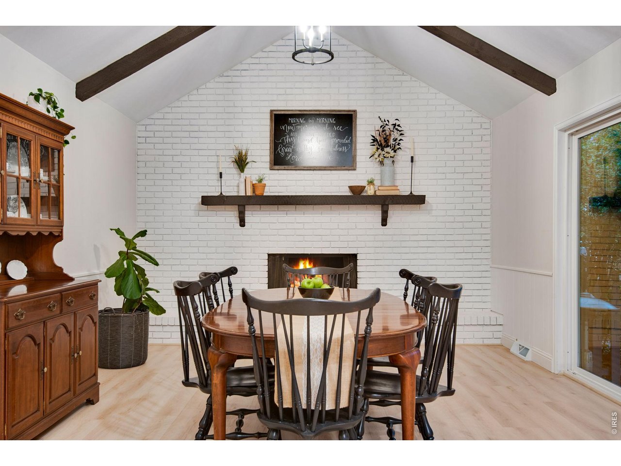 Full brick backsplash, wood burning fireplace and a wide mantel