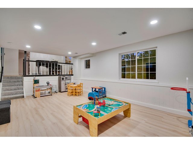 Property Photo 20 Recreation/living room features 6 can lights on dimmer. Perfect spot for a large in-home office