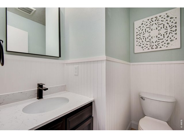 Property Photo 23 guest half bath off great room that has the wood burning fireplace