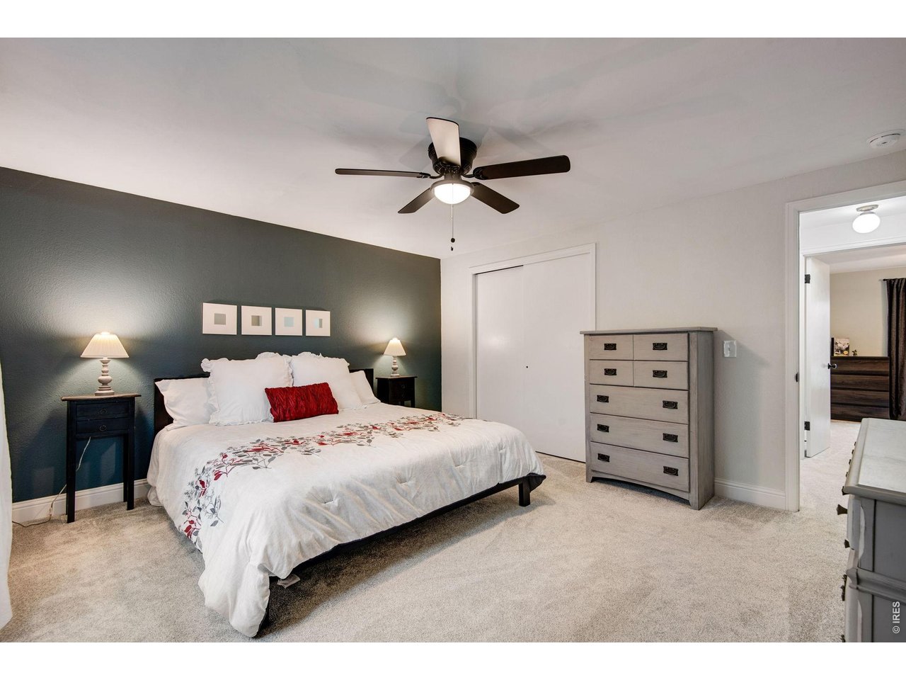 Primary bedroom with retreat, ceiling fan and private bath