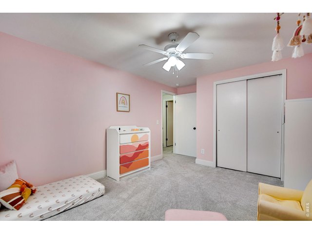 Property Photo 29 Bed 2 of 3 up features a ceiling fan