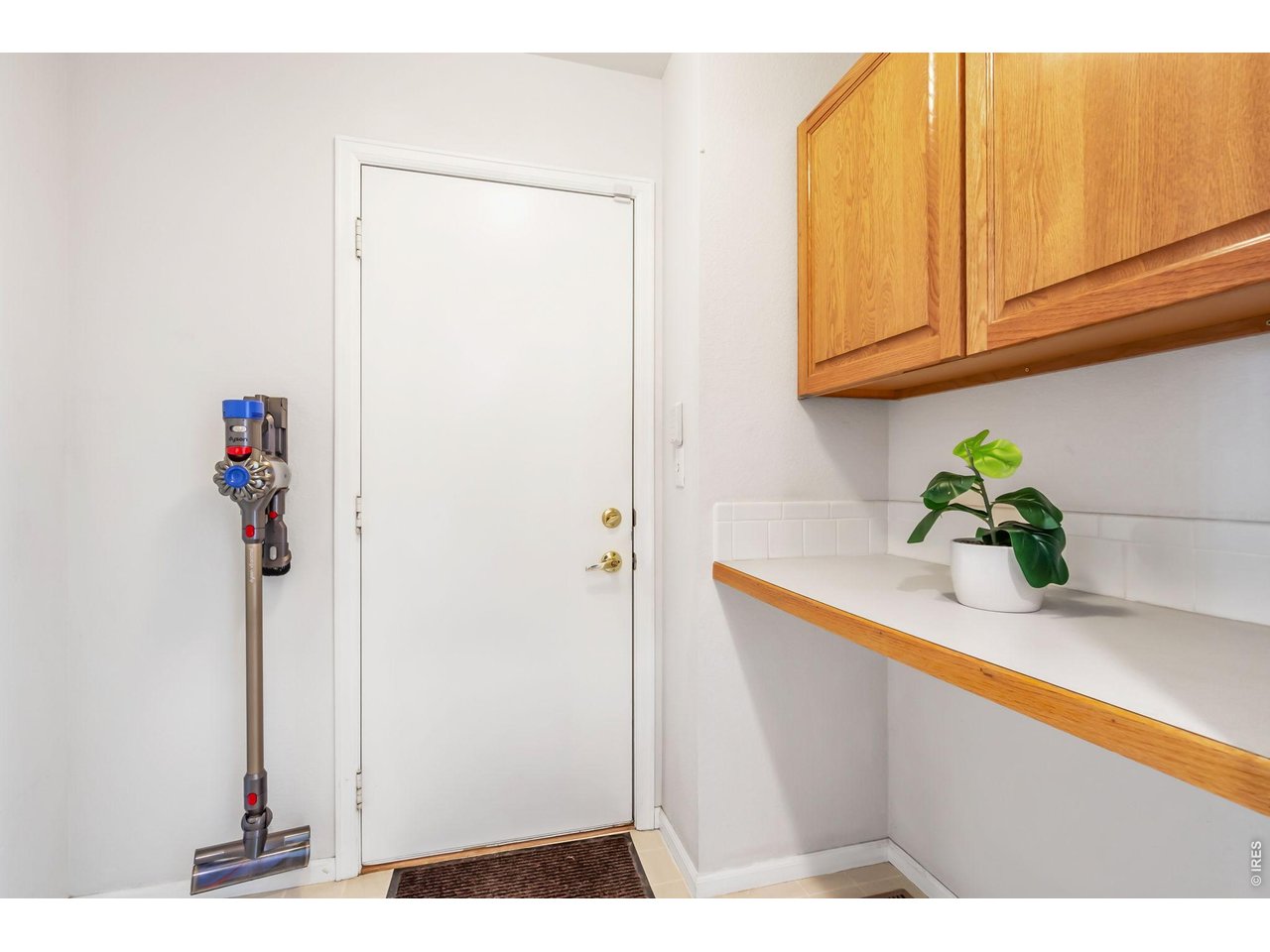 Laundry Room/Mud Room off of Garage with Storage and Counter Space