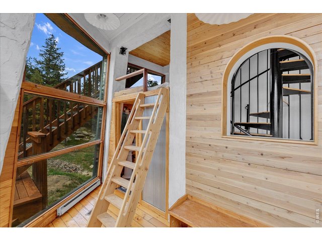 Property Photo 13 main level with ladder to sleeping loft