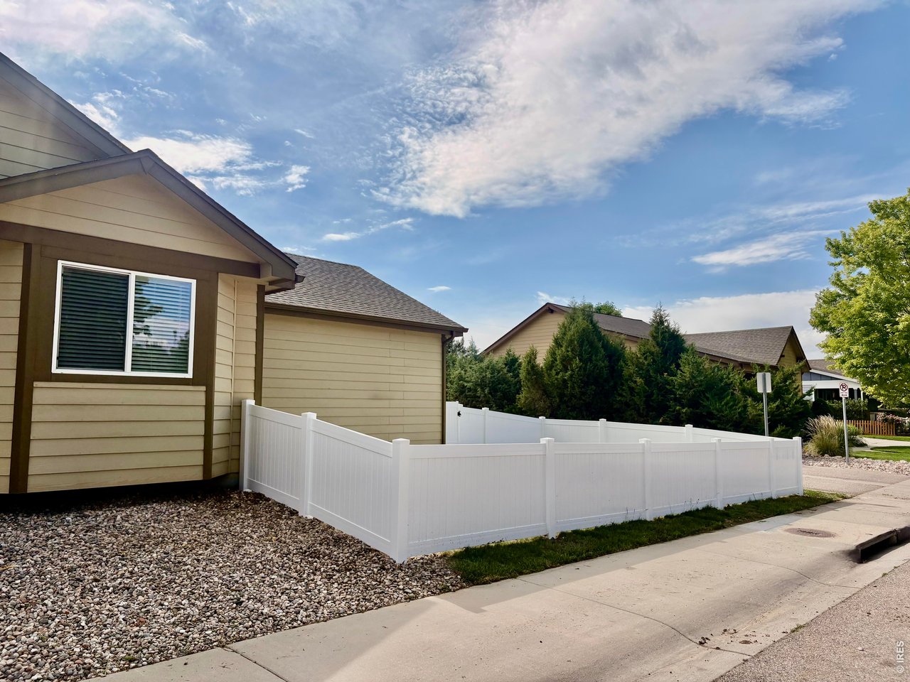 Brand new white vinyl fencing creates a more private and functional backyard!