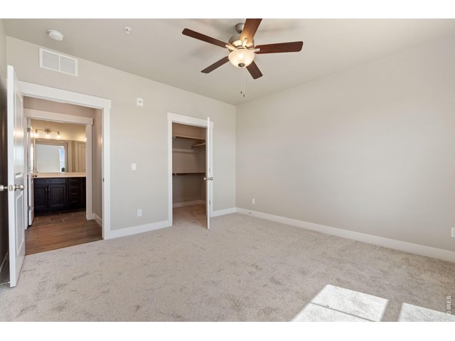 Property Photo 6 Primary bedroom. Ceiling fan included. 