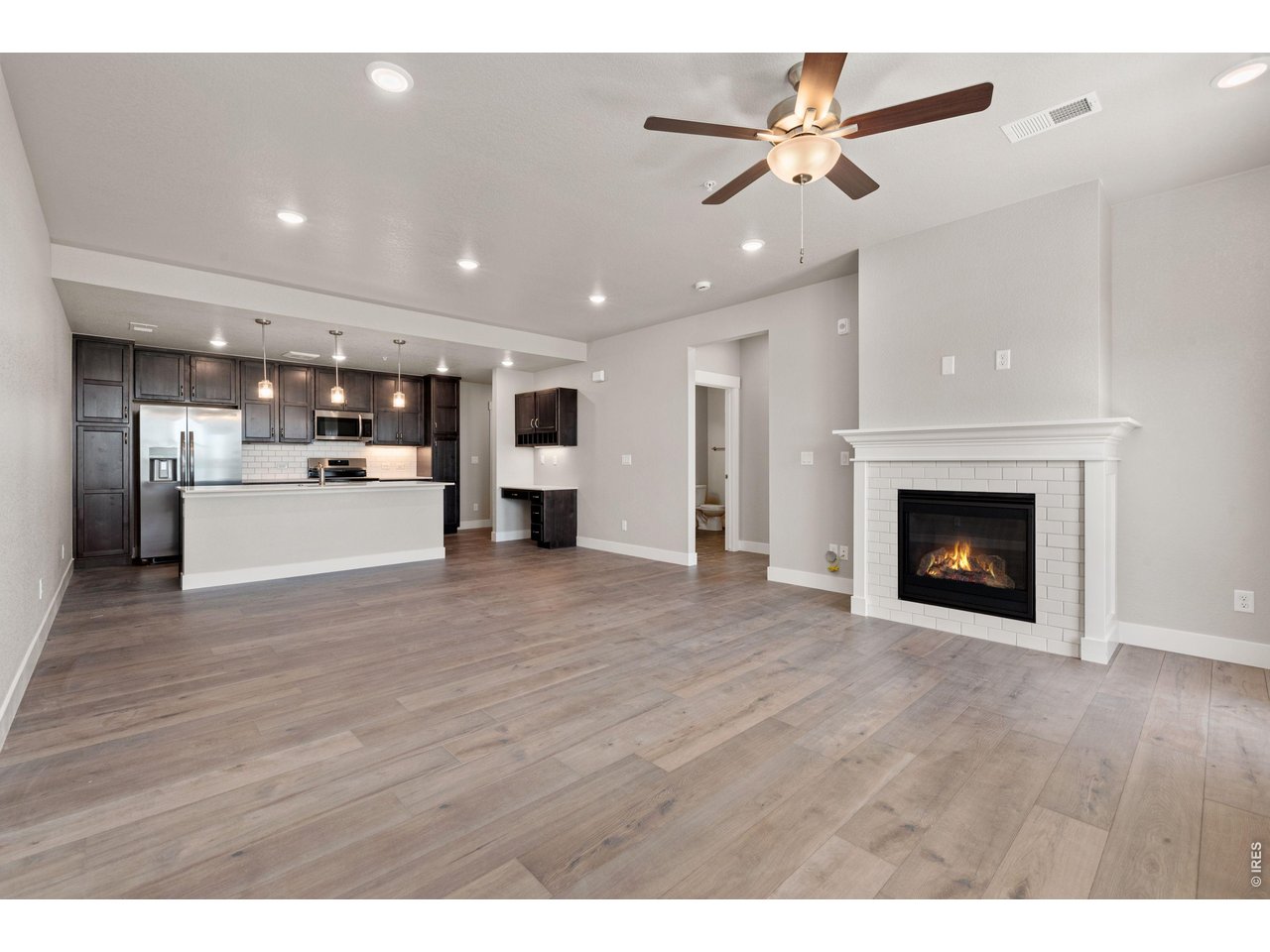 Property Photo 5 Open concept living spaces! Ceiling and fireplace included. 
