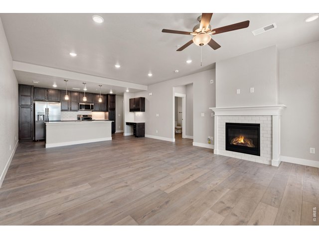Property Photo 5 Open concept living spaces! Ceiling and fireplace included. 