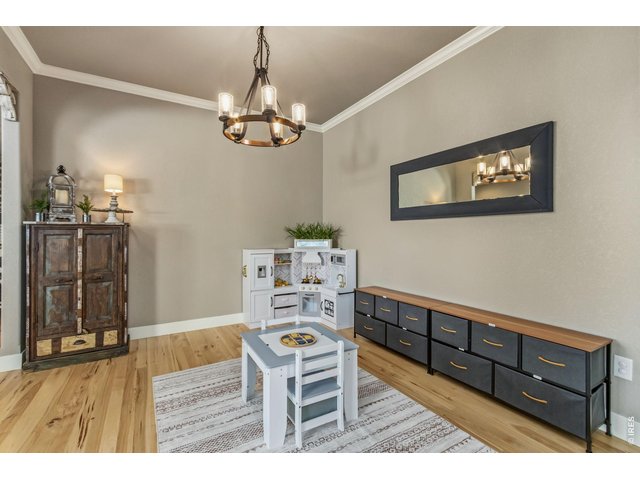 Property Photo 14 Additional main-level living space adds flexibility and function.