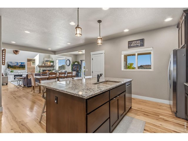 Property Photo 15 Oversized island with additional cabinet storage and plenty of prep space.