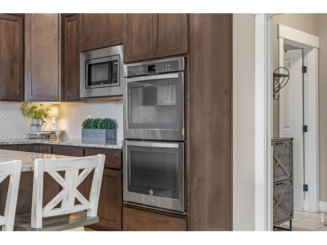 Property Photo 21 Stainless steel appliances including a double oven making entertaining and holiday cooking a breeze.