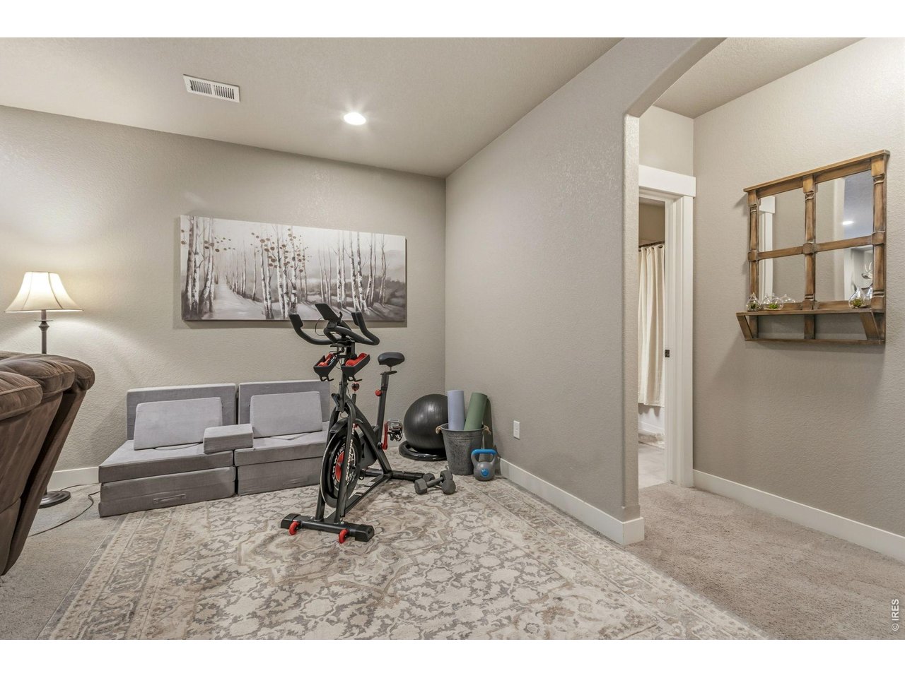Property Photo 35 Versatile bonus space perfect for a home gym, playroom, office, or hobby area.