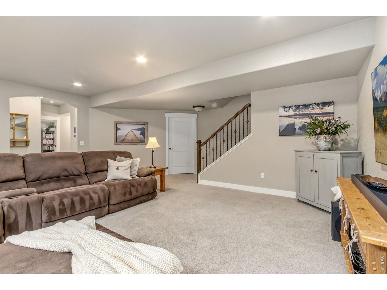 Property Photo 34 Expansive basement family room provides comfortable additional living space for family and guests.